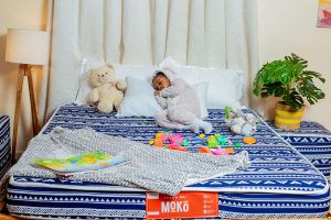 child sleeping soundly on her bed